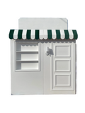 White Store Front With Custom Signage & Interchangeable Color Awning