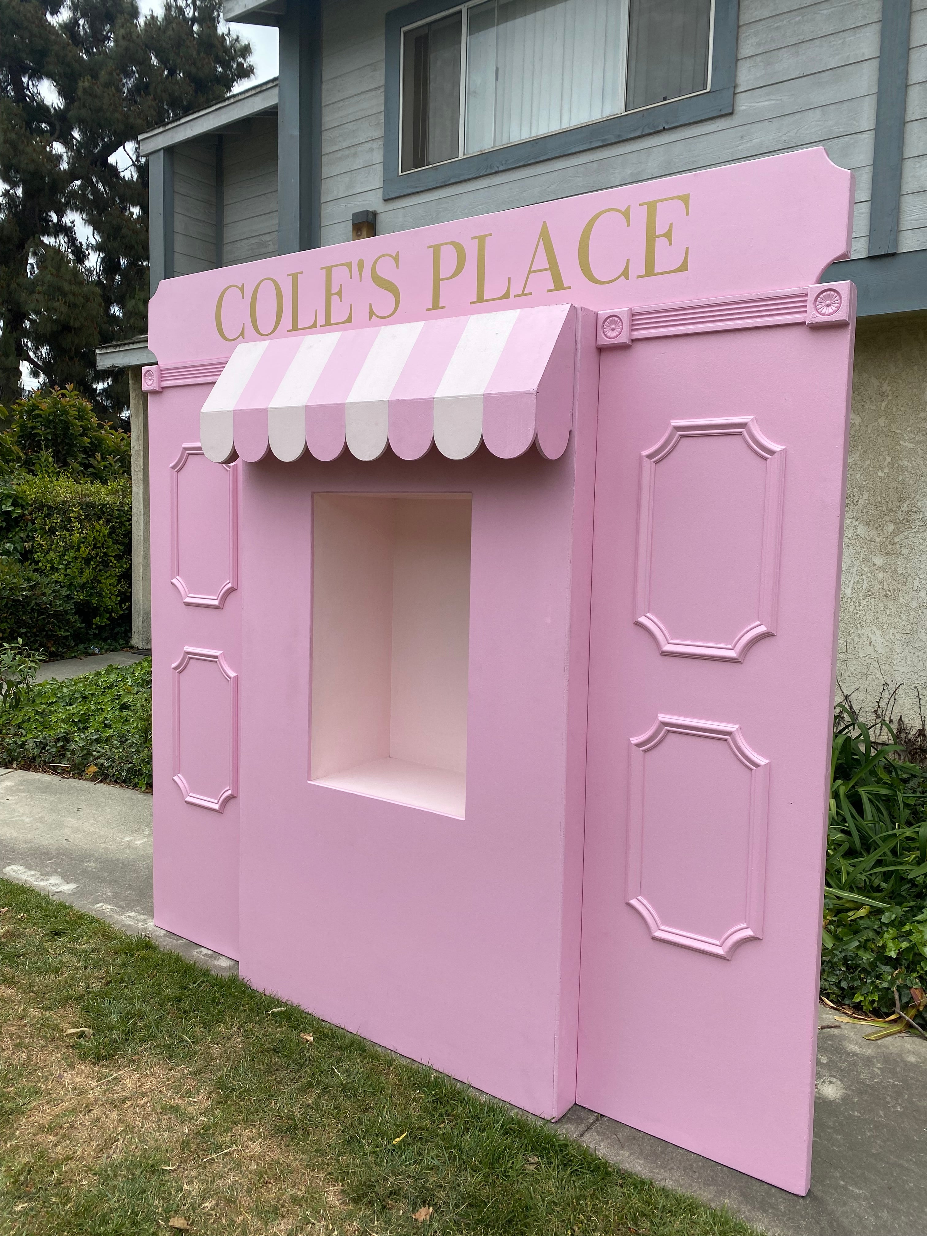 Light Pink Store Front With Custom Signage