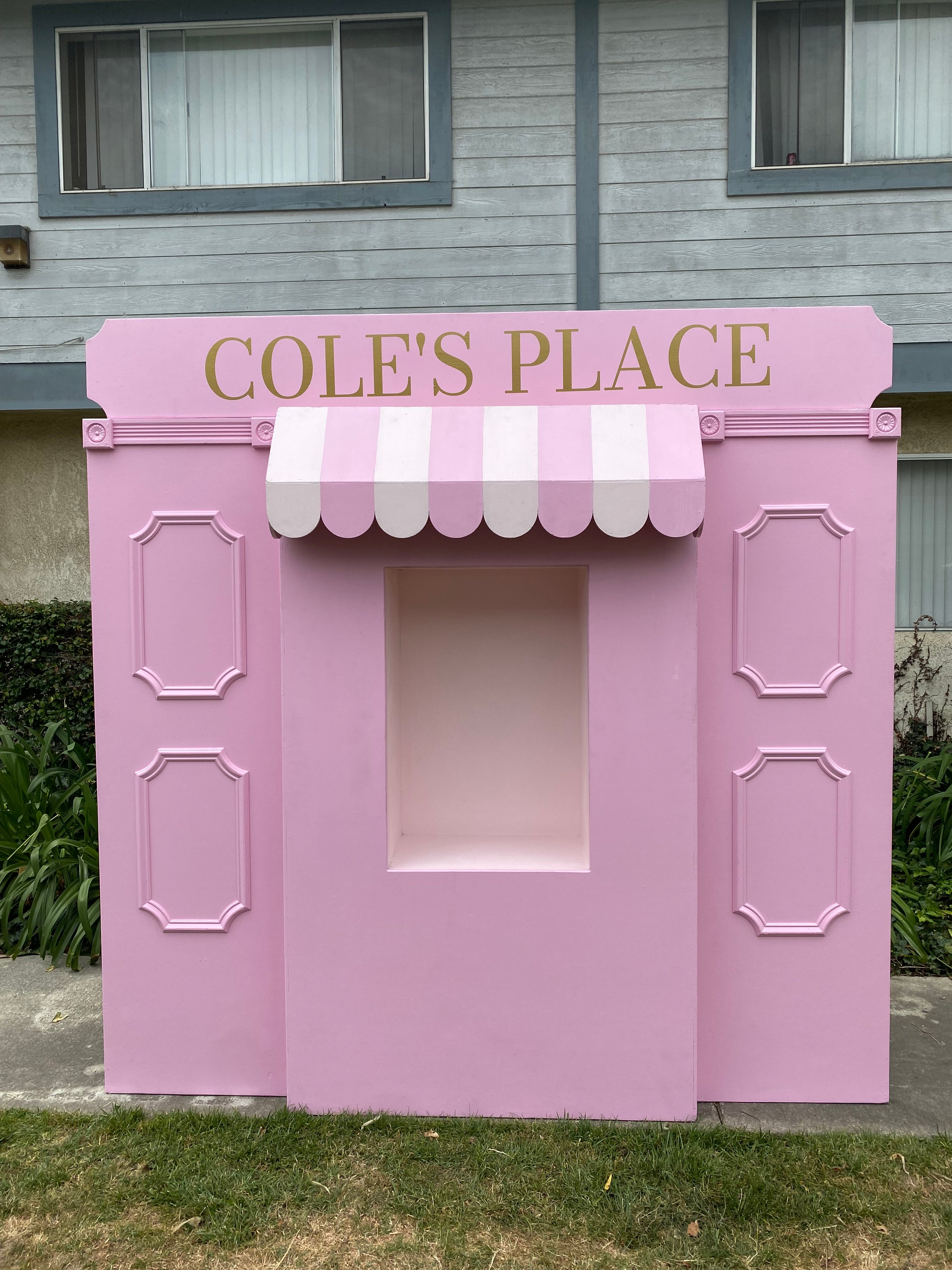 Light Pink Store Front With Custom Signage