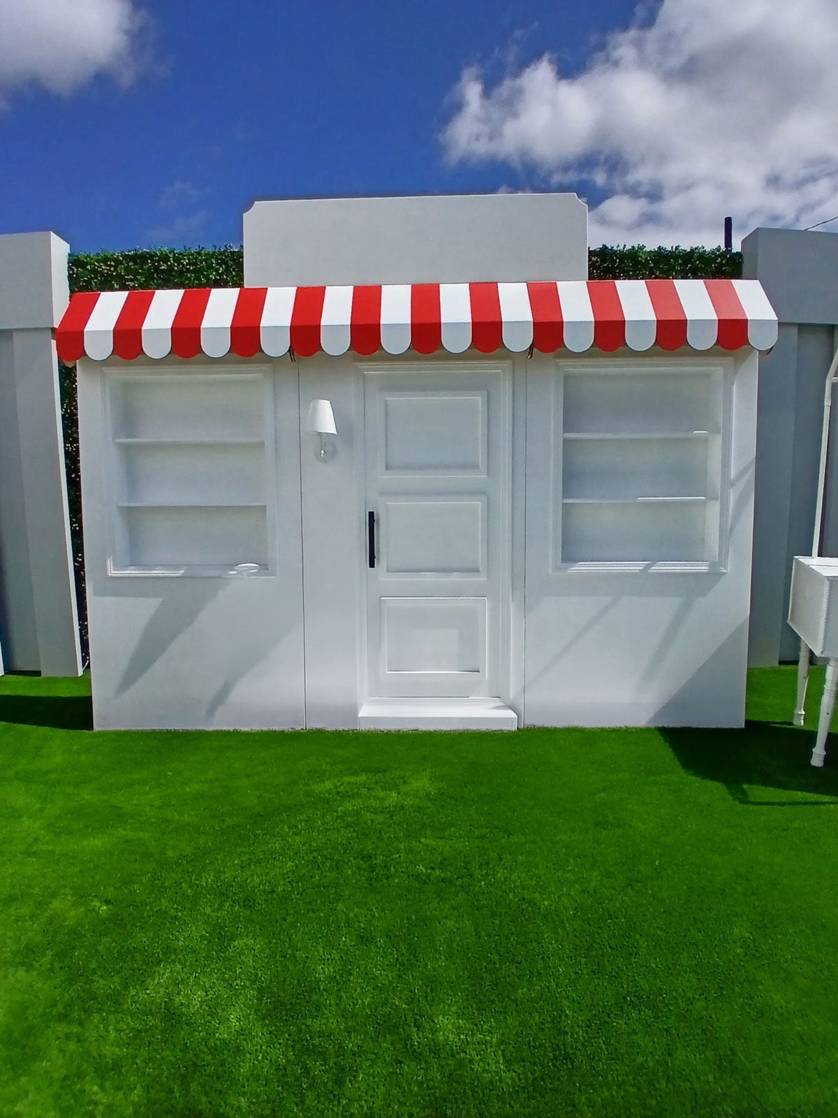 Three Panel White Store Front With Custom Signage & Interchangeable Color Awning